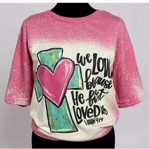Bleached Pink Scripture Tee | “He First Loved Us” | Faith Christian T-Shirt